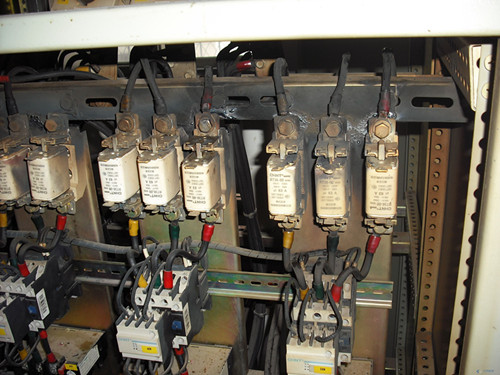 Within the active power capacitor compensation cabinet,  why are the cable connections not allowed?